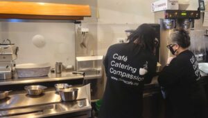 2 workers at coffee machine